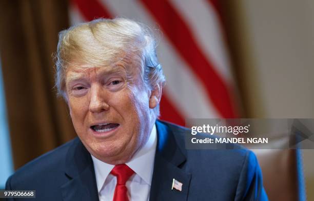 President Donald Trump speaks during a meeting with Republican members of Congress and Cabinet members in the Cabinet Room of the White House on June...