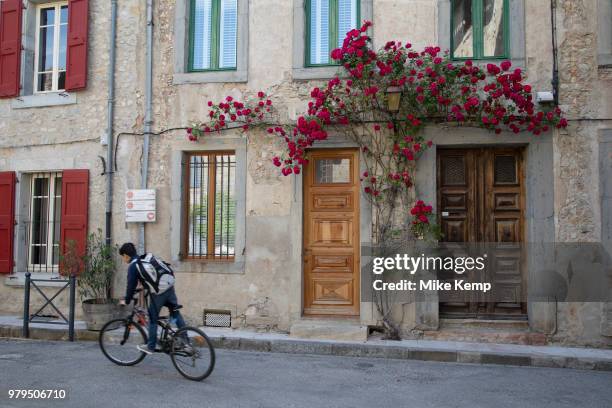 Scene in the medieval village of Lagrasse, Languedoc-Roussillon, France. Lagrasse is known as one of the most beautiful French villages. It lies in...