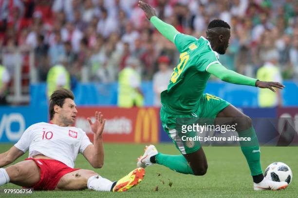 June 2018, Russia, Moscow: Soccer: World Cup 2018, group stages, group H: Poland vs Senegal at Spartak Stadium. Poland's Grzegorz Krychowiak and...