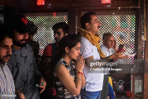 Hindu Devotees pray during the annual Hindu festival at the Kheer Bhawani Temple in Ganderbal district, some 30kms northeast of Srinagar, Indian...