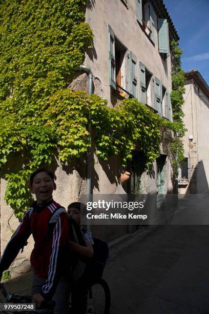 Scene in the medieval village of Lagrasse, Languedoc-Roussillon, France. Lagrasse is known as one of the most beautiful French villages. It lies in...