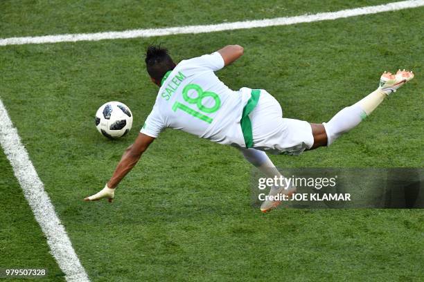 Saudi Arabia's forward Salem Al-Dawsari falls during the Russia 2018 World Cup Group A football match between Uruguay and Saudi Arabia at the Rostov...