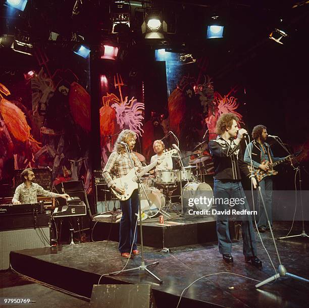 Peter Lemer, Paul Gurvitz, Ginger Baker, Steve Parsons and Adrian Gurvitz of the Baker Gurvitz Army perform on stage in 1975.