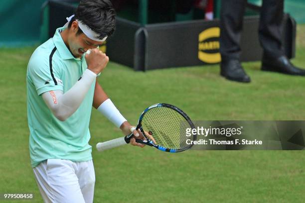 Yuichi Sugita of Japan celebrates after winning his match against Dominic Thiem of Austria during day three of the Gerry Weber Open at Gerry Weber...