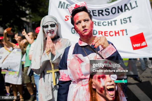 June 2018, Germany, Duesseldorf: Outside the Health Ministers' Conference, nursing and care workers protest in zombie costumes. Photo: Rolf...