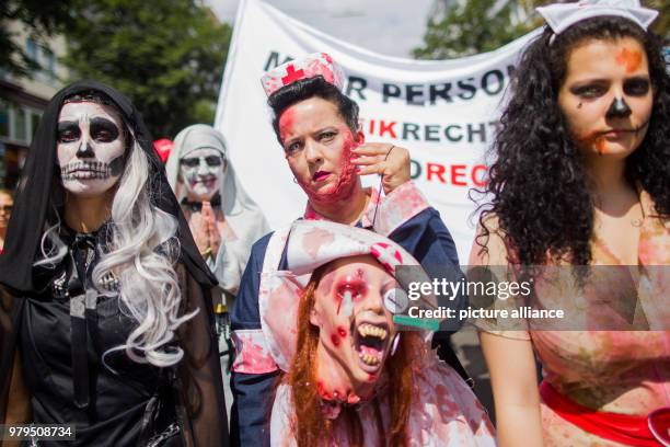 June 2018, Germany, Duesseldorf: Outside the Health Ministers' Conference, nursing and care workers protest in zombie costumes. Photo: Rolf...