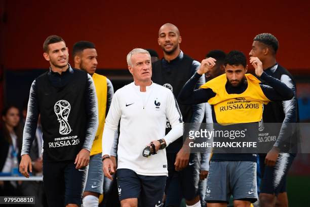 France's coach Didier Deschamps attends with team-mates a training session at the Ekaterinburg Arena in Ekaterinburg on June 20, 2018 on the eve of...