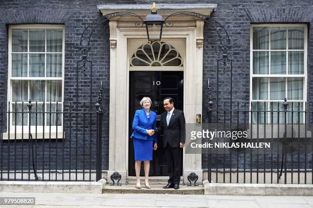 Britain's Prime Minister Theresa May meets Prime Minister of Thailand, Prayut Chan-o-cha at 10 Downing Street in central London on June 20, 2018.