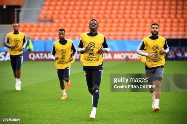 France's forward Ousmane Dembele and France's defender Adil Rami attend a training session at the Ekaterinburg Arena in Ekaterinburg on June 20, 2018...