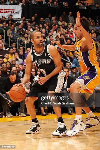 Tony Parker of the San Antonio Spurs handles the ball against Sasha Vujacic of the Los Angeles Lakers during the game on February 8, 2010 at Staples...