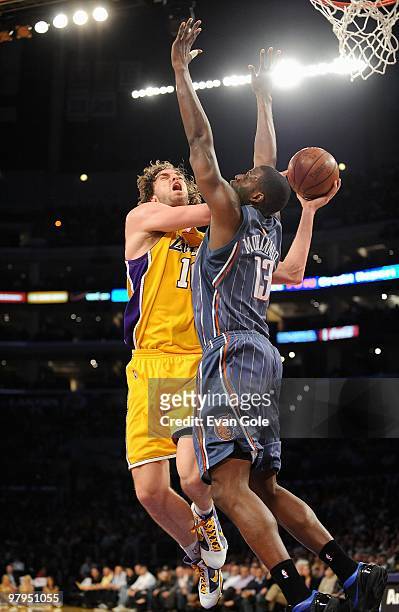 Pau Gasol of the Los Angeles Lakers goes to the basket against Nazr Mohammed of the Charlotte Bobcats during the game on February 3, 2010 at Staples...