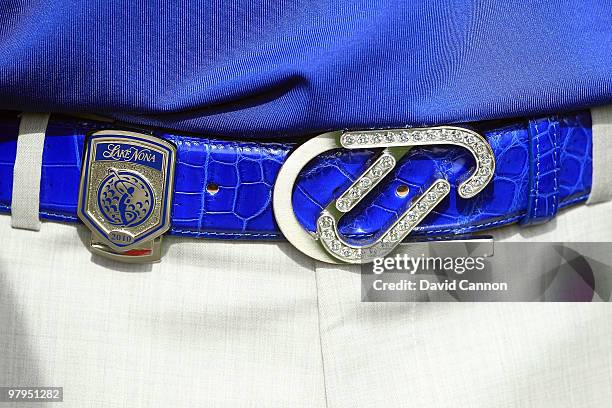 Ian Poulter of England shows a sparkling belt buckle during the first day's play in the 2010 Tavistock Cup, at the Isleworth Golf and Country Club on...