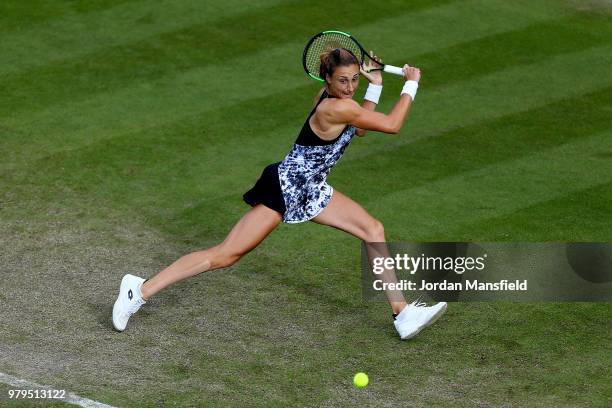 Petra Martic of Croatia reaches for a backhand during her Round of 16 match against Mihaela Buzarnescu of Romania during Day Five of the Nature...