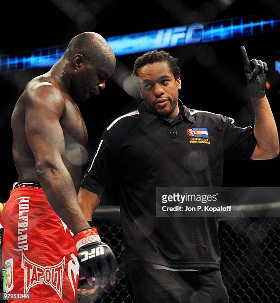 Fighter Cheick Kongo gets a point deducted by referee Herb Dean for an illegal knee to the face of UFC fighter Paul Buentello during their...