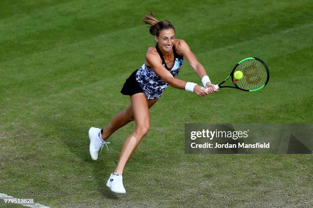 Petra Martic of Croatia reaches for a backhand during her Round of 16 match against Mihaela Buzarnescu of Romania during Day Five of the Nature...