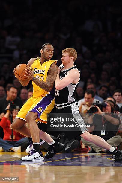 Josh Powell of the Los Angeles Lakers posts up against Matt Bonner of the San Antonio Spurs during the game on February 8, 2010 at Staples Center in...