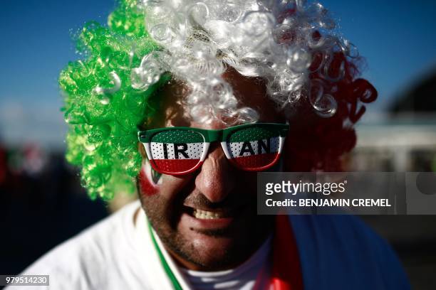 An Iranian supporter poses for a picture ahead of the Russia 2018 World Cup Group B football match between Iran and Spain at the Kazan Arena in Kazan...