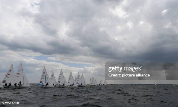 June 2018, Germany, Kiel: Sailers in the 470 class participate in a race on the Schilksee as part of the Kiel Week. The Kiel Week is the world's...