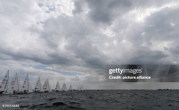 June 2018, Germany, Kiel: Sailers in the 470 class participate in a race on the Schilksee as part of the Kiel Week. The Kiel Week is the world's...