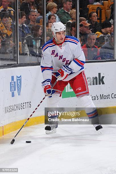 Dan Girardi the New York Rangers skates with the puck against the Boston Bruins at the TD Garden on March 21, 2010 in Boston, Massachusetts.