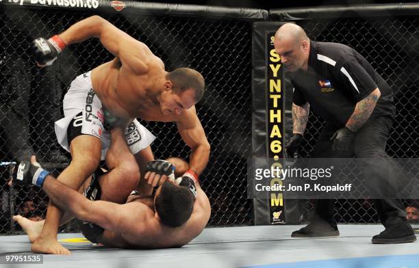 Fighter Junior Dos Santos battles UFC fighter Gabriel Gonzaga with referee Josh Rosenthal looking on during their Heavyweight fight at UFC Fight...