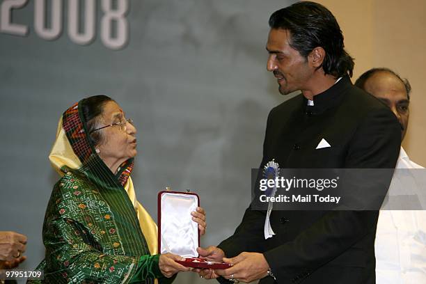 President Pratibha Patil presents the best supporting actor award to Arjun Rampal for his role in feature film Rock On during the 56th National Film...