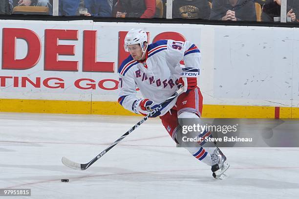 Matt Gilroy of the New York Rangers skates with the puck against the Boston Bruins at the TD Garden on March 21, 2010 in Boston, Massachusetts.