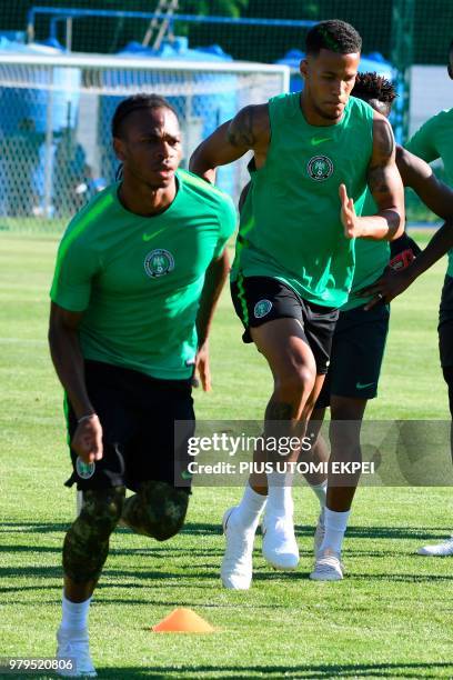 Nigeria's midfielder Joel Chukwuma Obi and Nigeria's defender William Troost-Ekong attend a training session at Essentuki Arena in southern Russia on...