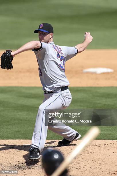 Pitcher John Maine of the New York Mets pitches during a game against the Florida Marlins at Roger Dean Stadium on March 14, 2010 in Jupiter, Florida.