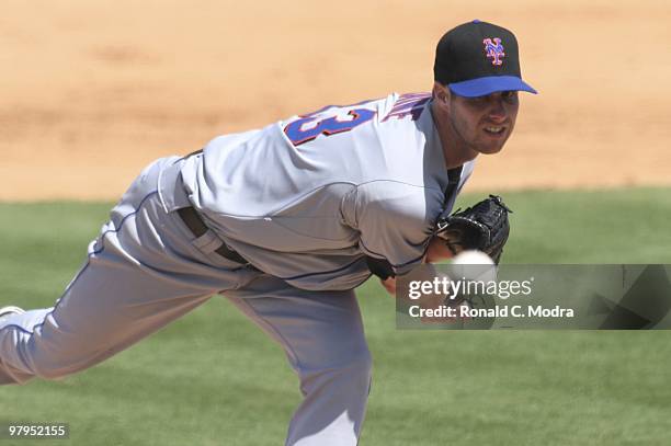 Pitcher John Maine of the New York Mets pitches during a game against the Florida Marlins at Roger Dean Stadium on March 14, 2010 in Jupiter, Florida.