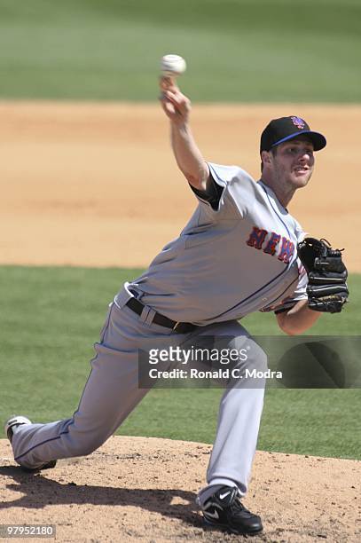 Pitcher John Maine of the New York Mets pitches during a game against the Florida Marlins at Roger Dean Stadium on March 14, 2010 in Jupiter, Florida.