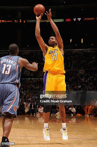 Andrew Bynum of the Los Angeles Lakers shoots over Nazr Mohammed of the Charlotte Bobcats during the game on February 3, 2010 at Staples Center in...