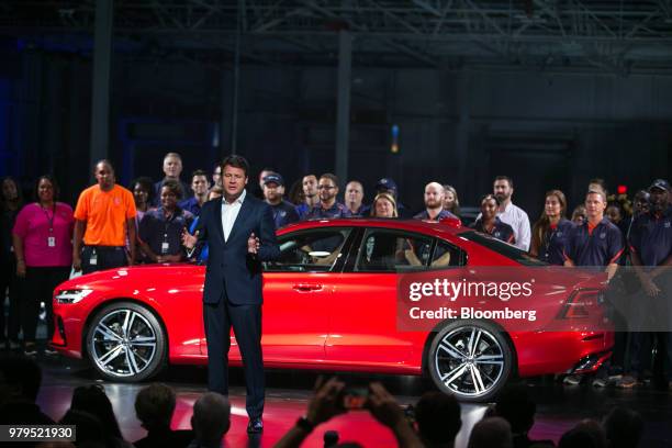 Anders Gustafsson, senior vice president of North America for Volvo Car AB, speaks in front of a Volvo S60 vehicle at the official opening of the...