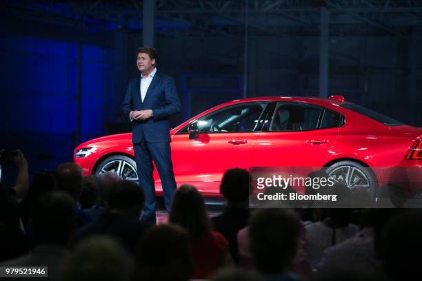 Anders Gustafsson, senior vice president of North America for Volvo Car AB, speaks in front of a Volvo S60 vehicle at the official opening of the...