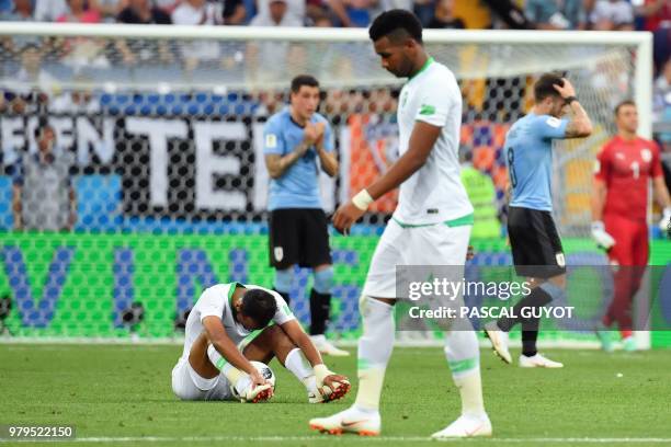 Saudi Arabia's midfielder Abdullah Otayf sits on the field at the end of the Russia 2018 World Cup Group A football match between Uruguay and Saudi...