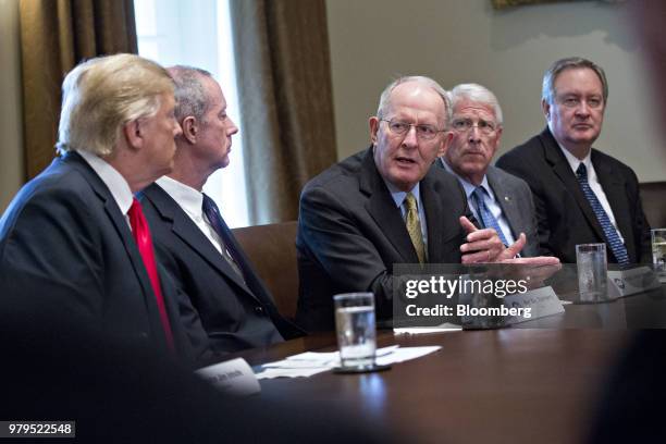 Senator Lamar Alexander, a Republican of Tennessee, center, speaks as U.S. President Donald Trump, left, listens during a meeting with Republican...