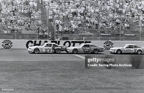 Dean Combs leads Dale Earnhardt and Morgan Shepherd around the 95th lap of the World 600.