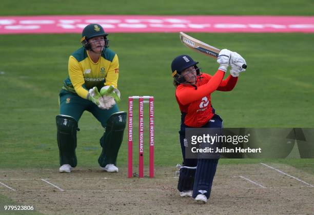 Lizelle Lee of South Africa looks on as Tammy Beaumont of England scores runs during the International T20 Tri-Series match between England Women and...