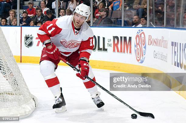 Daniel Cleary of the Detroit Red Wings controls the puck during a game against the Edmonton Oilers at Rexall Place on March 19, 2010 in Edmonton,...