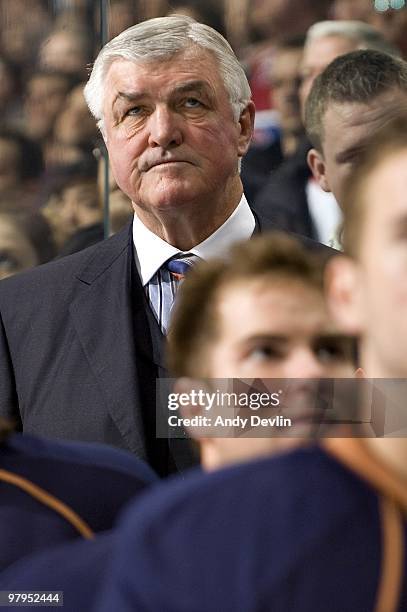 Pat Quinn, head coach for the Edmonton Oilers, stands for the national anthems before his team plays against the Detroit Red Wings at Rexall Place on...