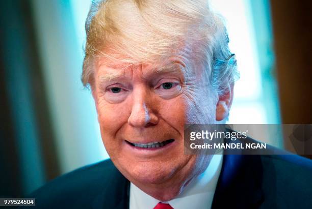 President Donald Trump speaks during a meeting with Republican members of Congress and Cabinet members in the Cabinet Room of the White House on June...