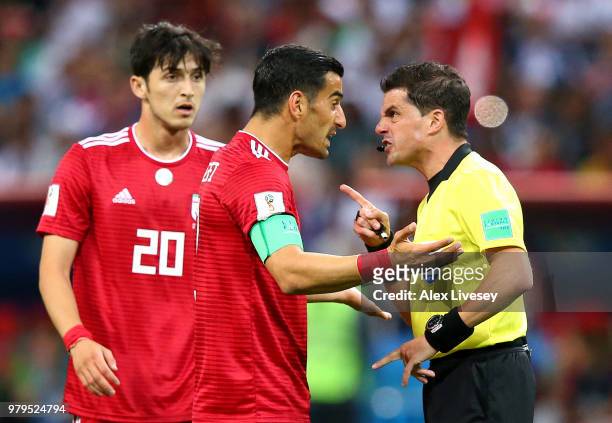 Ehsan Haji Safi of Iran argues with Referee Andres Cunha during the 2018 FIFA World Cup Russia group B match between Iran and Spain at Kazan Arena on...