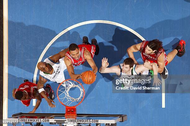 Jared Jeffries of the Minnesota Timberwolves rebounds against Damien Wilkins and Kevin Love of the Houston Rockets during the game at Target Center...