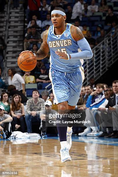 Carmelo Anthony of the Denver Nuggets moves the ball up court during the game against the New Orleans Hornets at New Orleans Arena on March 12, 2010...