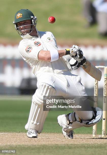 Phillip Hughes of Australia dodges a bouncer during day five of the First Test match between New Zealand and Australia at Westpac Stadium on March...