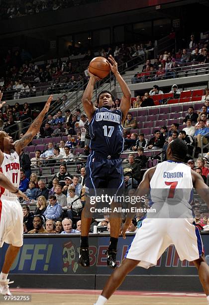 Ronnie Price of the Utah Jazz shoots a jump shot against Chucky Atkins and Ben Gordon of the Detroit Pistons during the game at the Palace of Auburn...