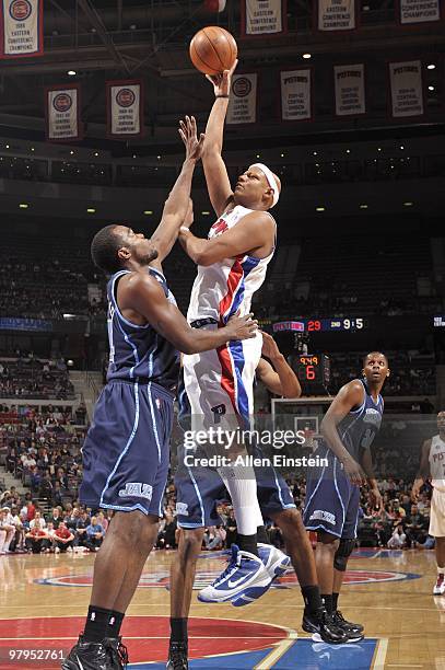 Charlie Villanueva of the Detroit Pistons goes up for a shot against Paul Millsap of the Utah Jazz during the game at the Palace of Auburn Hills on...