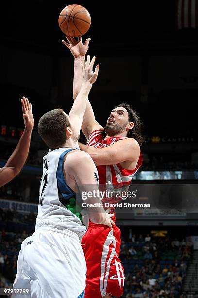 Luis Scola of the Minnesota Timberwolves shoots over Kevin Love of the Houston Rockets during the game at Target Center on March 06, 2010 in...