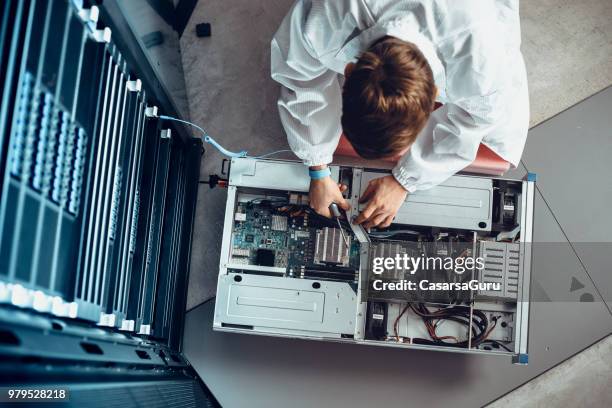 it engineer servicing part of a supercomputer - 2018 technology stock pictures, royalty-free photos & images