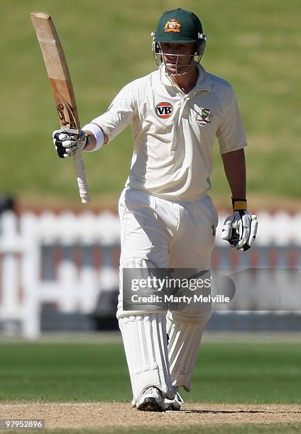Phillip Hughes of Australia celebrates his half century during day five of the First Test match between New Zealand and Australia at Westpac Stadium...